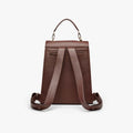 Shows the backside of the backpack, feauturing a  zipper pocket, adjustable shoulder straps and detachable top handle. 